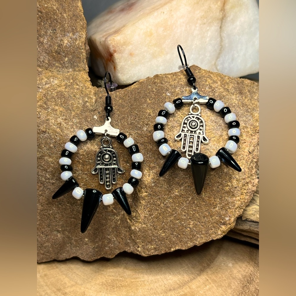 Drop hoop earrings/silver hamsa hand inside charm/black/white/black spike glass